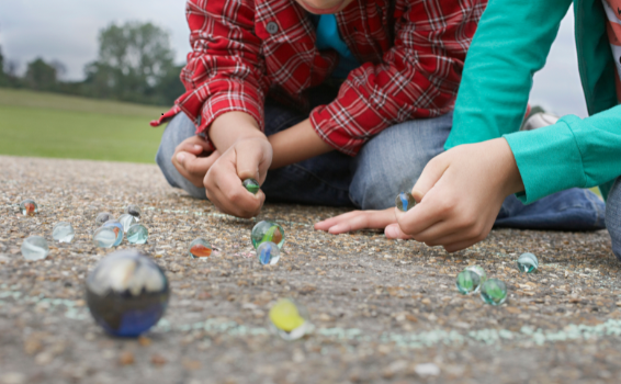 Kids playing marbles
