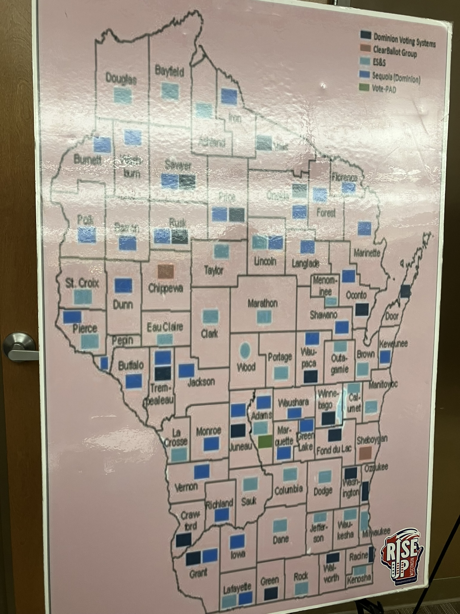 A Wisconsin map showing the manufacturers of voting machines in each county.