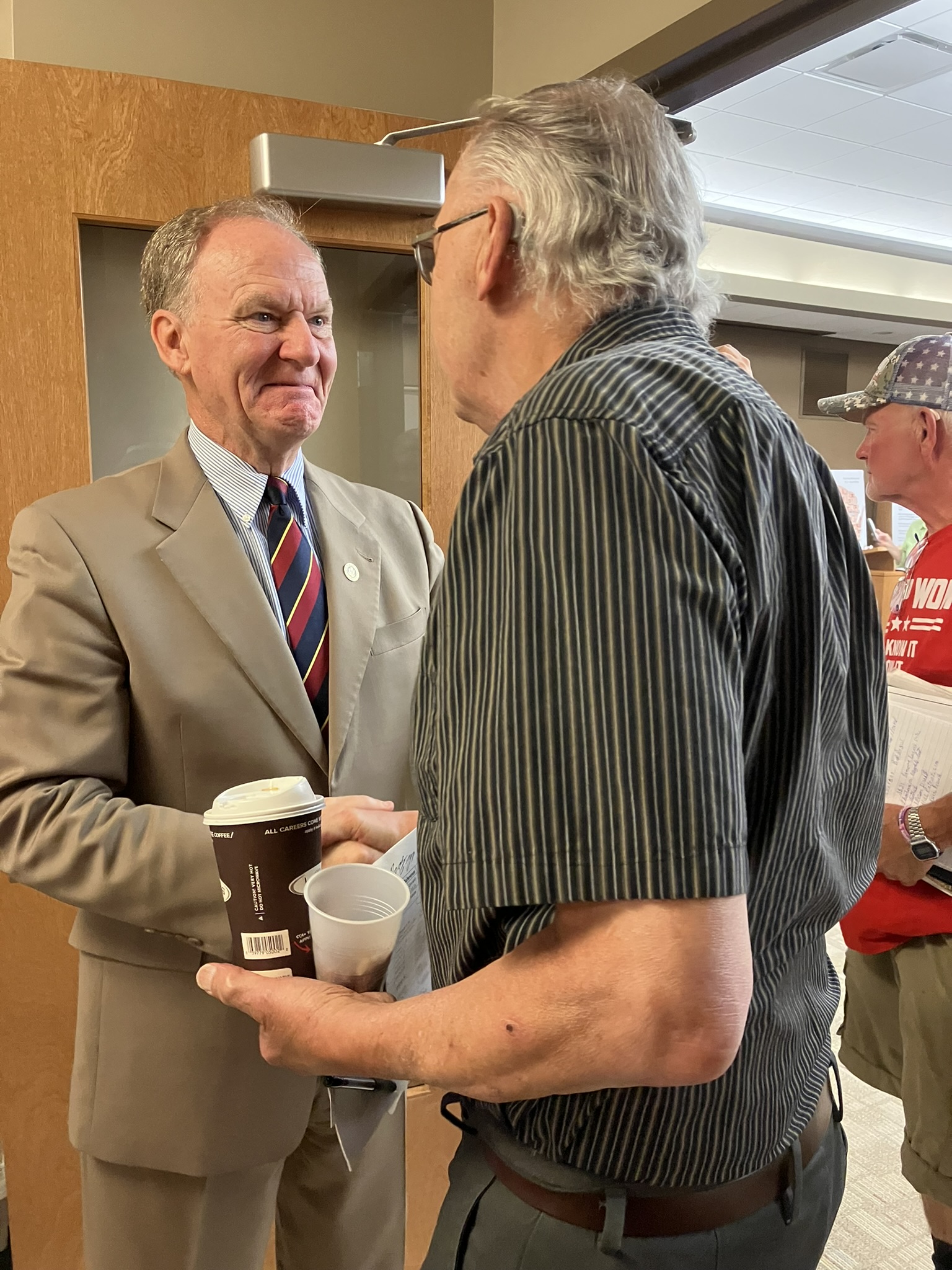Jefferson Davis chats with a guest after the July NEW Patriots meeting.