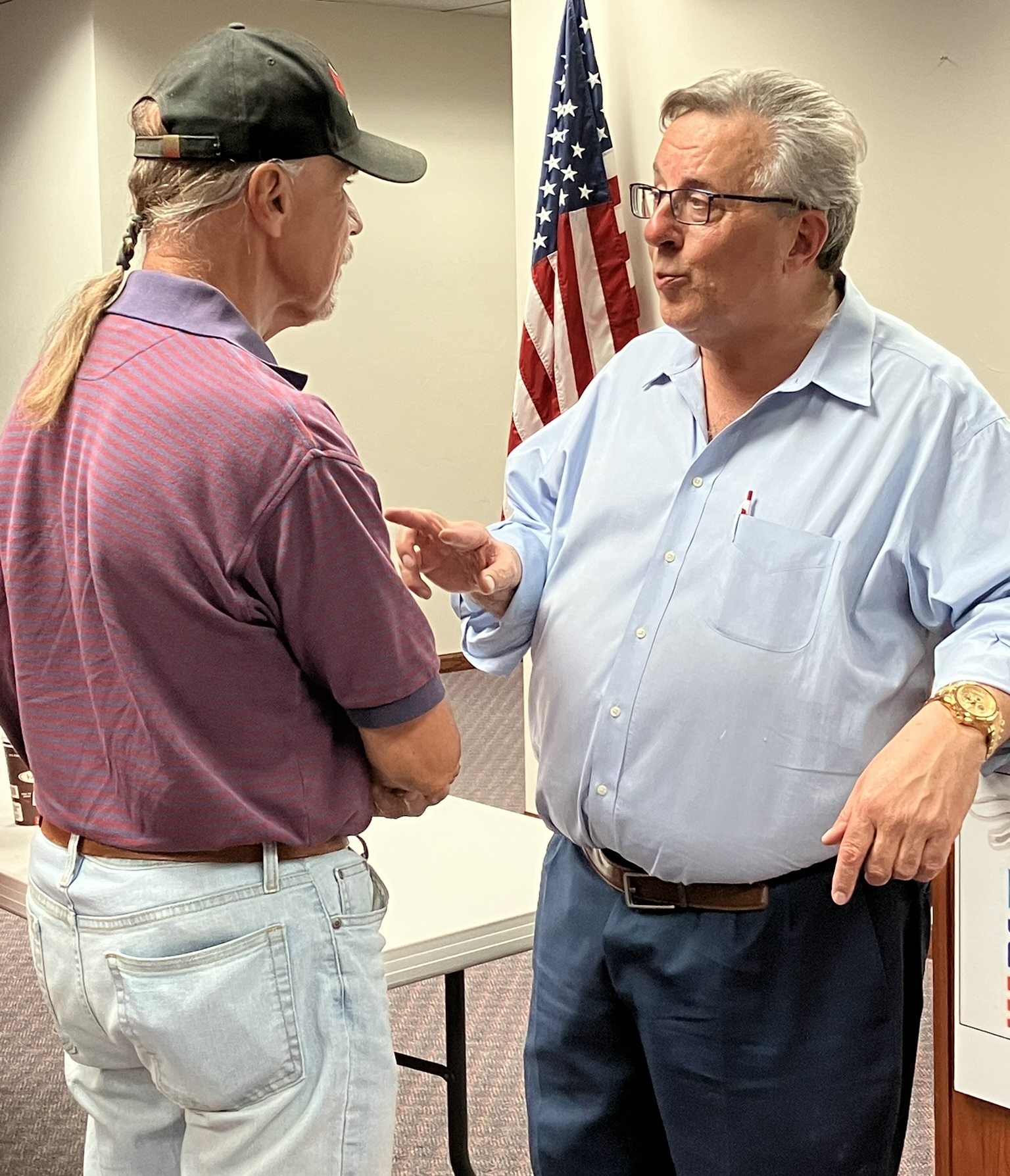 Brian Schimming, chairman of the Republican Party of Wisconsin, engages with audience members after the August 7, 2023 meeting of Fox Valley Initiative.