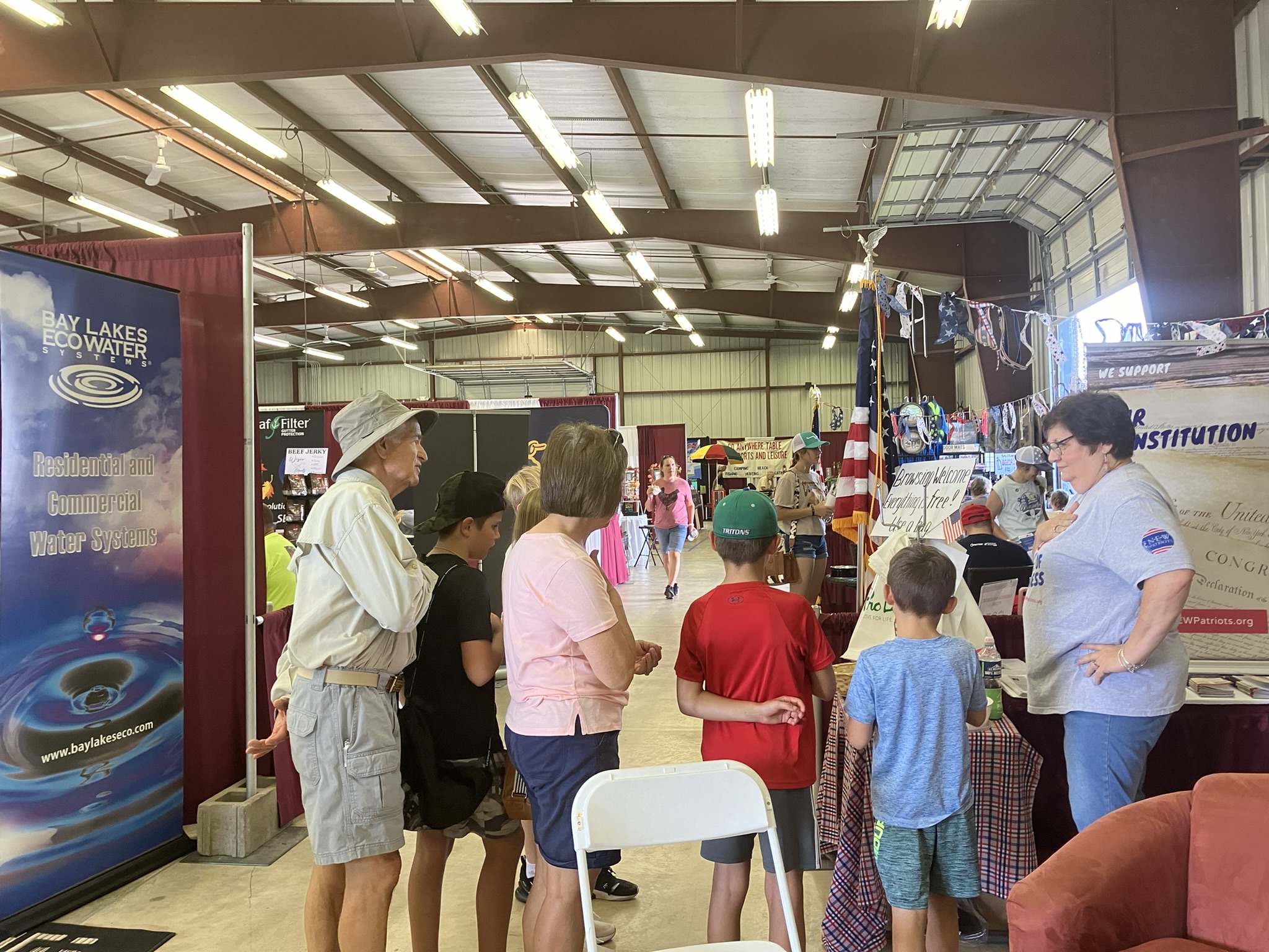 Volunteer leading visitors in the Pledge of Allegiance.